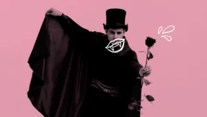 Ein Bild zeigt einen Mann verkleidet als Dracula mit einer Rose in der Hand.