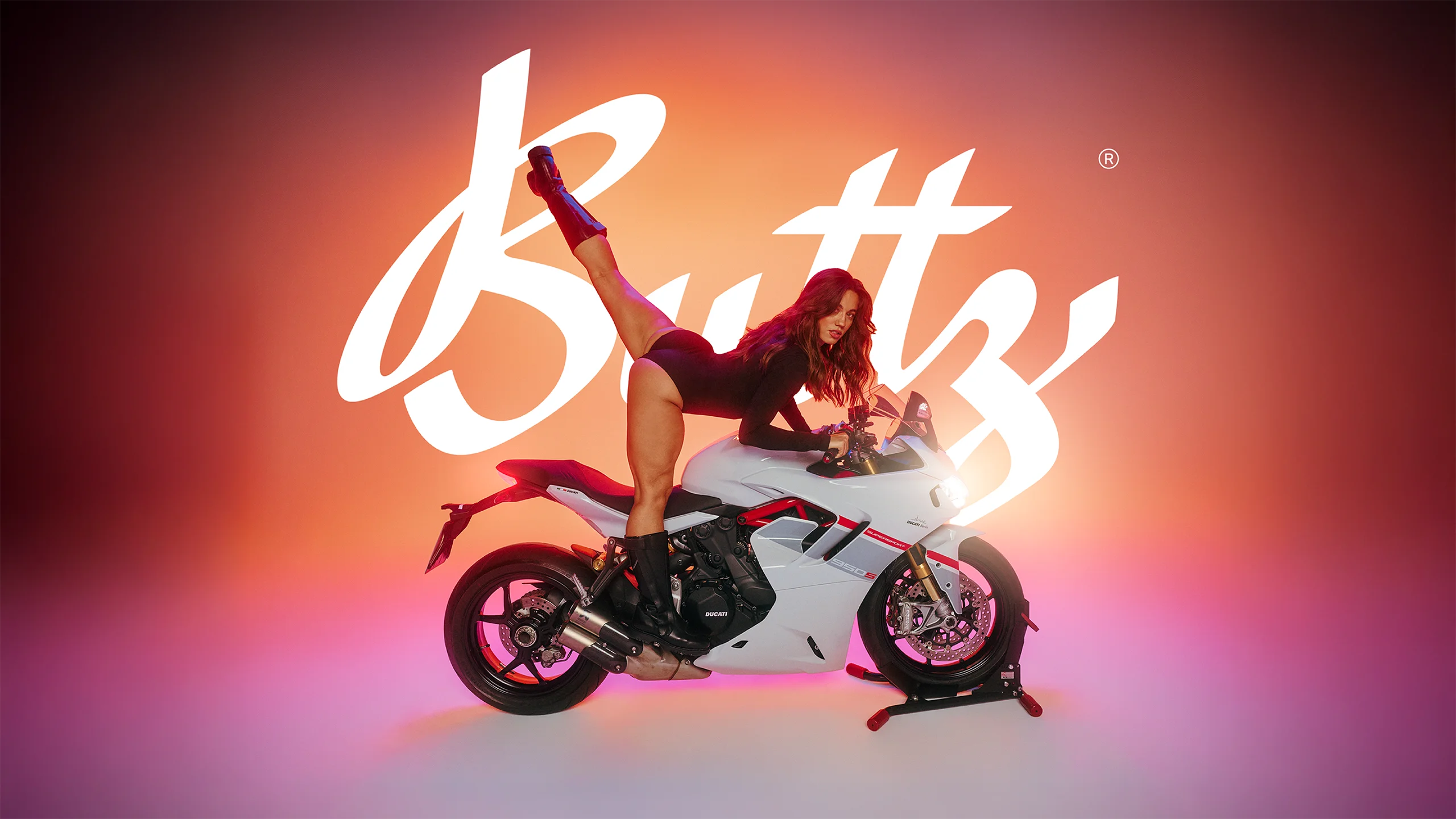 Buttz - Woman posing on motorcycle